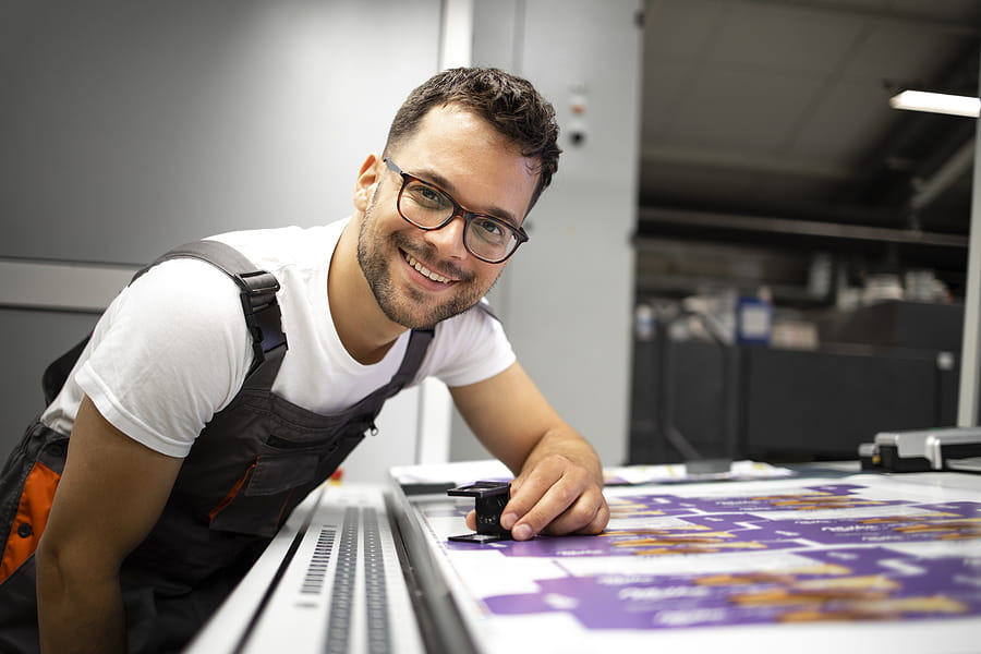 Print professional controlling print quality in a wholesale printing house company